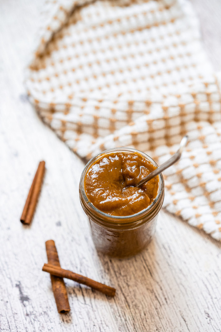 Pumpkin butter with Super Youth collagen in a mason jar with a spoon.