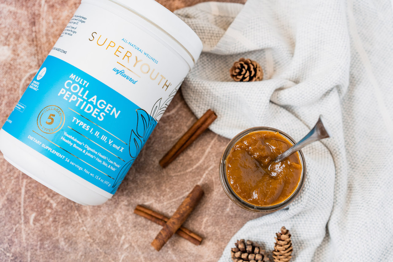 Super Youth collagen peptides container beside a jar of pumpkin butter.