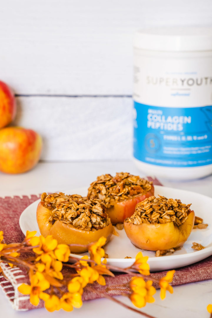 Three baked cinnamon apples on a plate with Super Youth collagen peptides